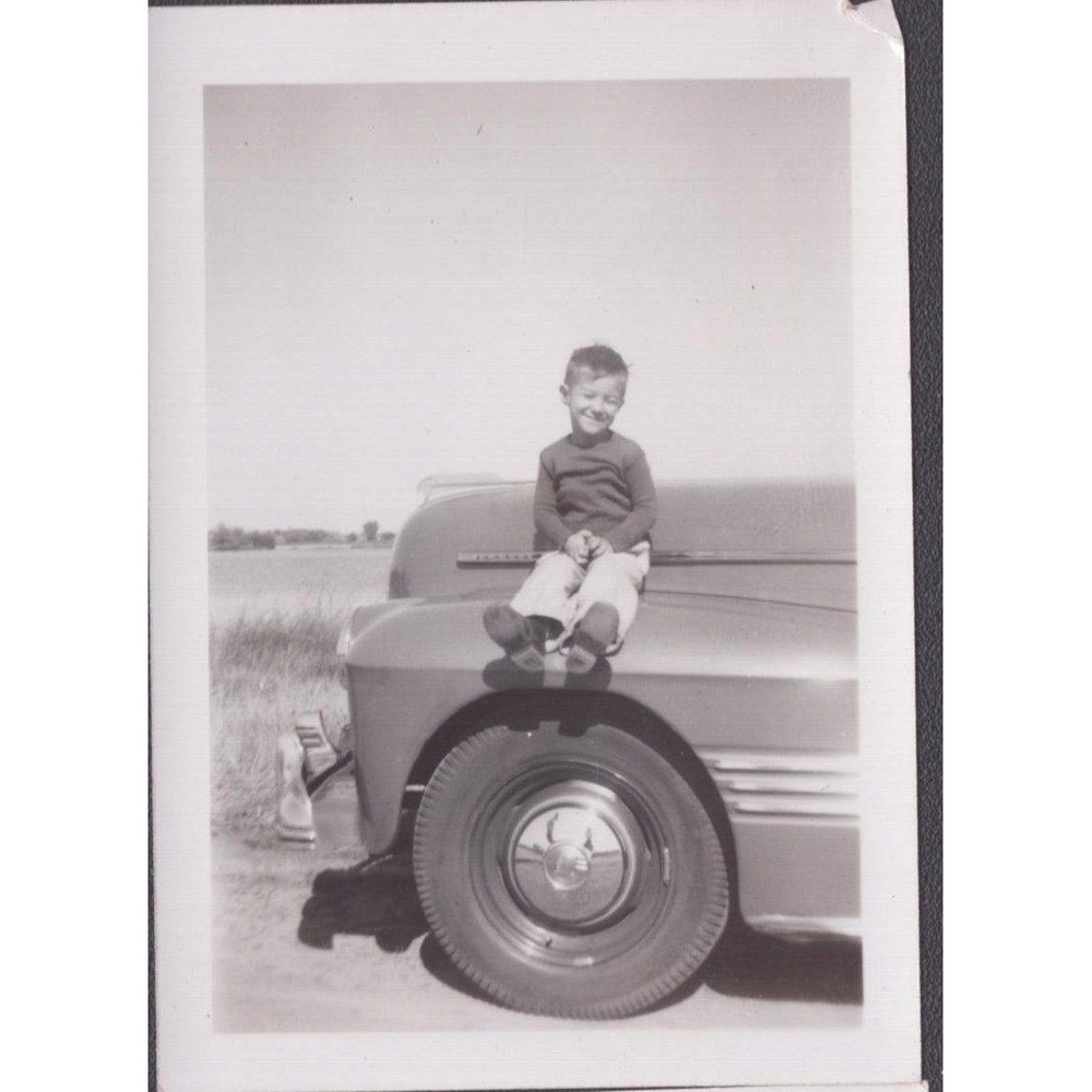 Vintage 1950s Snapshot Boy Sitting on Truck Hood Fender Photo